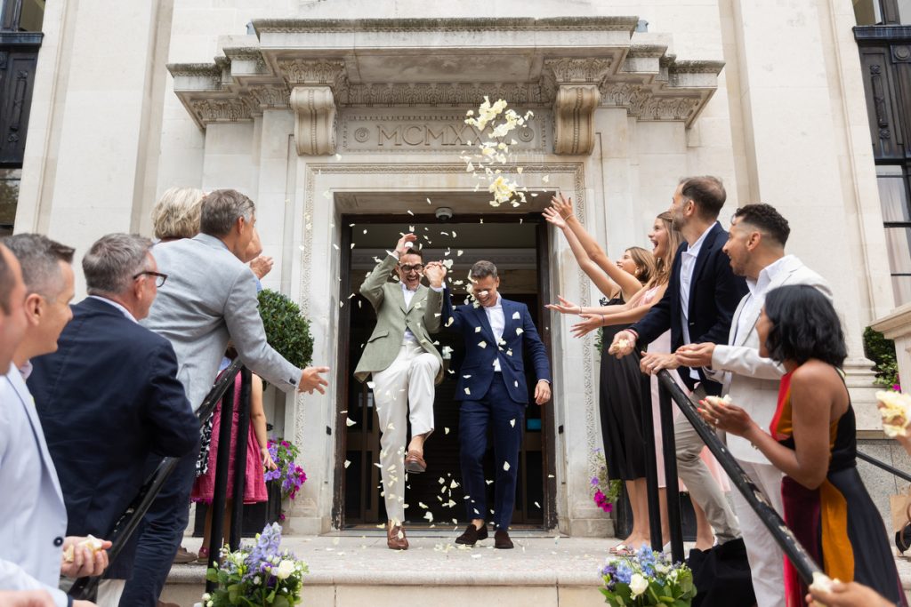 Two grooms exiting Islington Town Hll