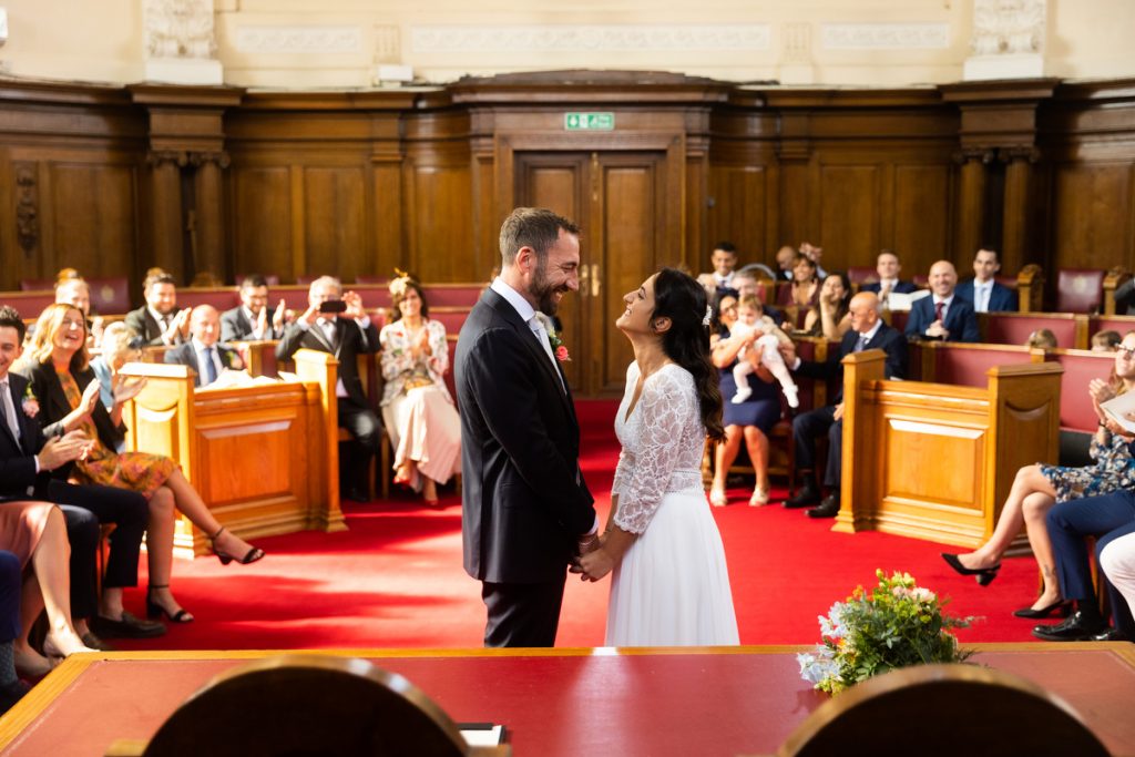 Bride and groom sharing a moment in the Council Chamber at Islington Town Hall