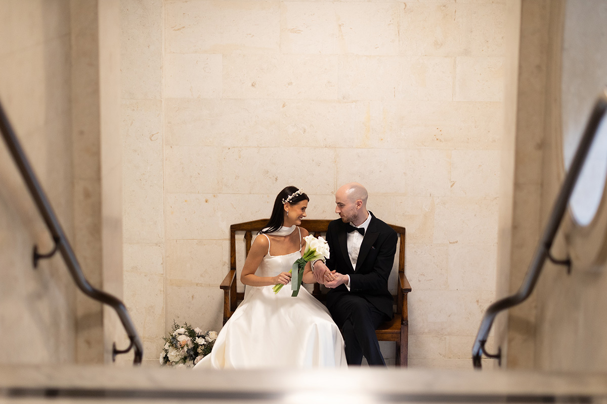 Couple relaxing after getting married at Marylebone Old Town Hall.