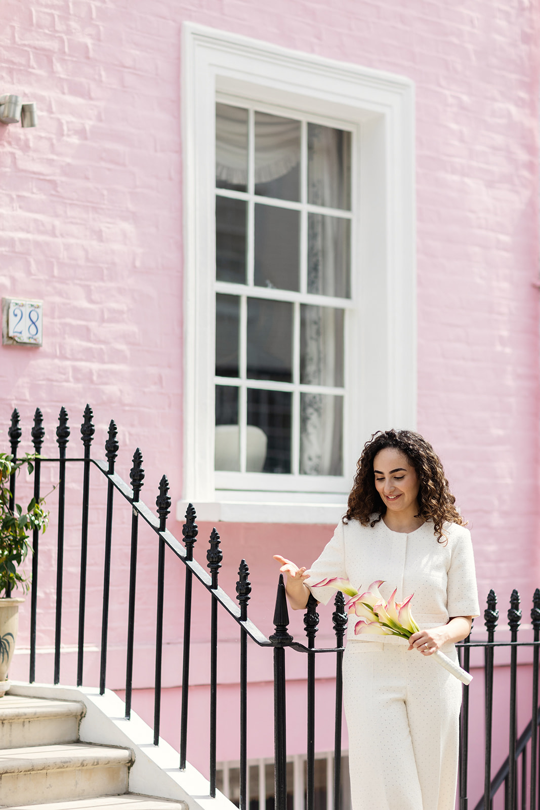 Bride wearing trousers at wedding in Chelsea