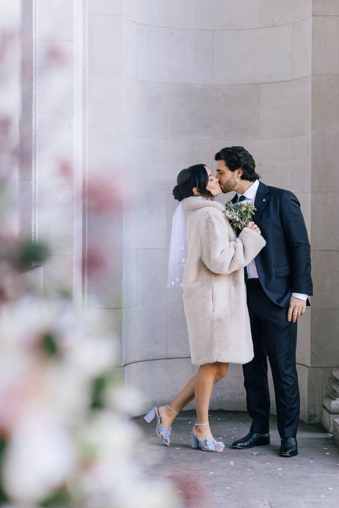 bride and groom kissing at Marylebone Registry Office